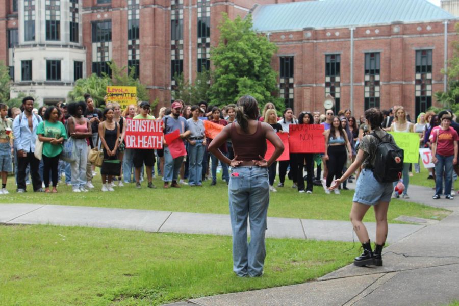Camilla Johnson and Crow Carson, students of professor Scott Heath speak at a protest on April 26, 2023. Students are advocating for the rehire of Heath.