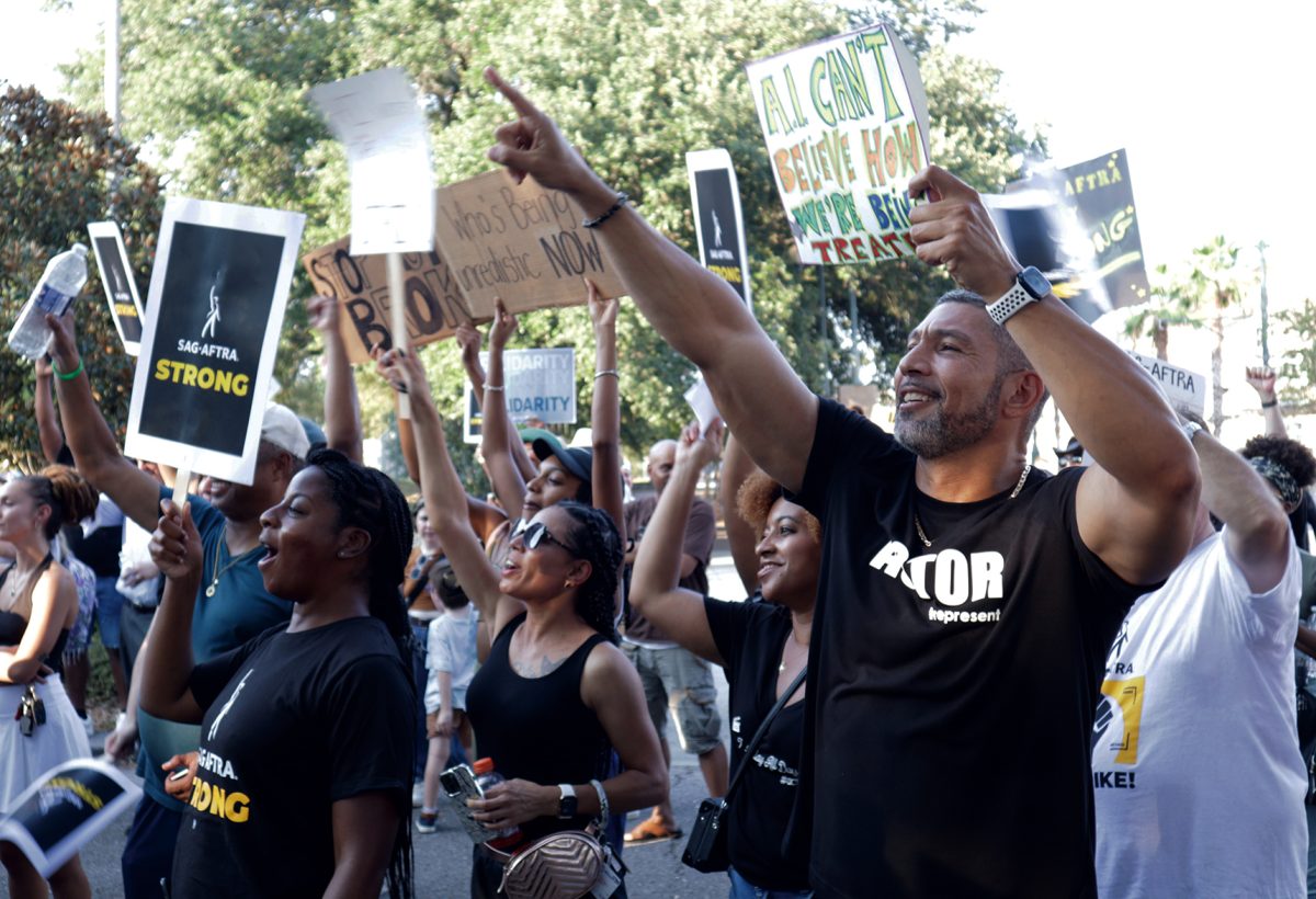 Actors, writers, and supporters gather in front of Louis Armstrong Park for a SAG-AFTRA New Orleans Local demonstration, Aug. 24, 2023. The writers' strike has been ongoing for several months since its start in July.