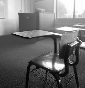 An empty chair sits in an empty Bobet classroom. Loyola has struggled with faculty retention amidst a lack of financial support. 
