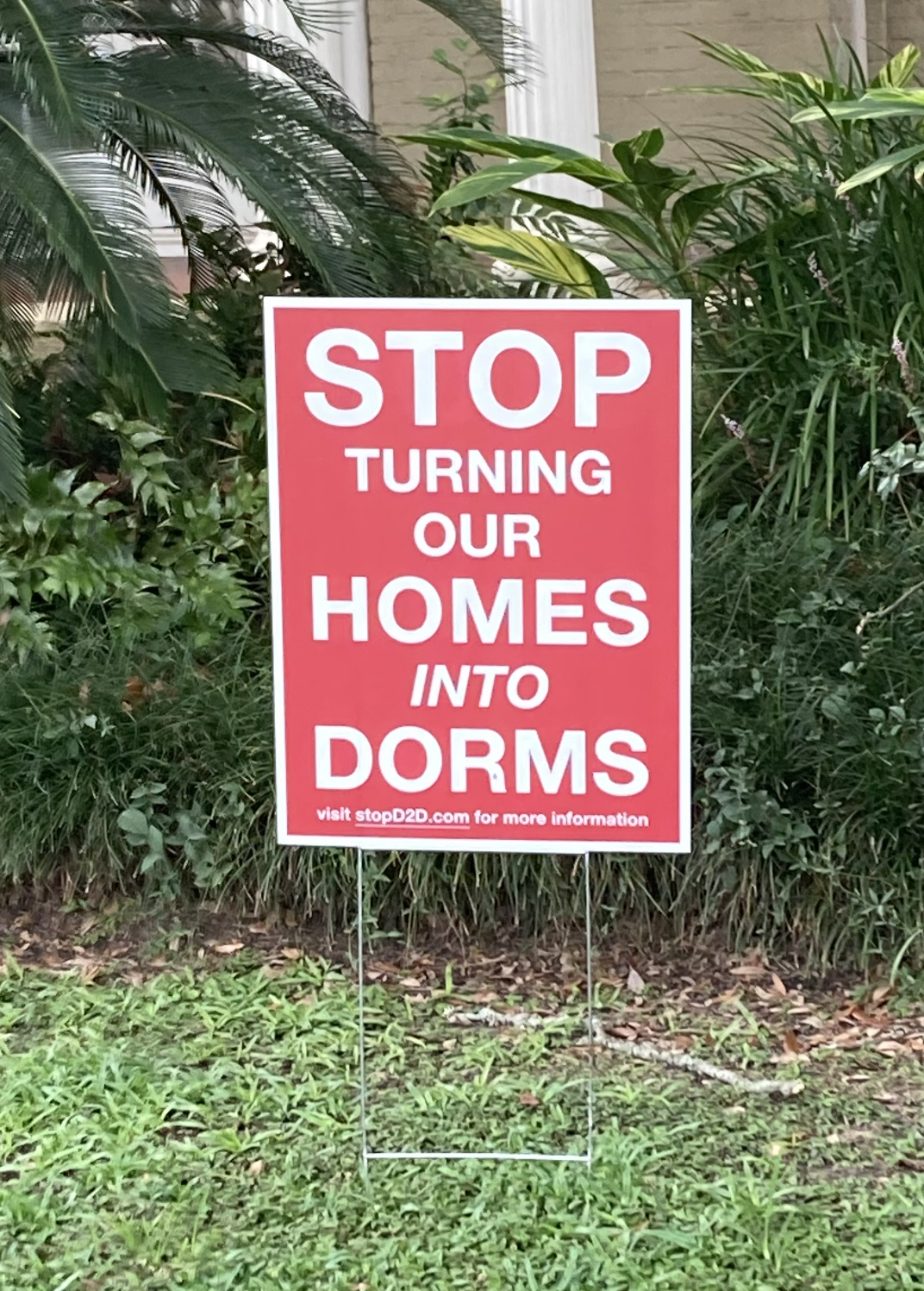 Yard sign for the Doubles-to-Dorms lobbying group, Sept. 12, 2023. The group has been calling for government action in preventing doubles homes from being converted into student housing. 