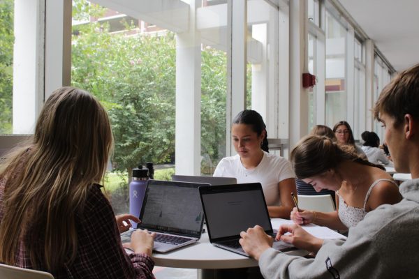 Sarah Perry and her friends sit in the Danna Center on their laptops. A new Wi-Fi system has been implemented on campus to better fir students needs.