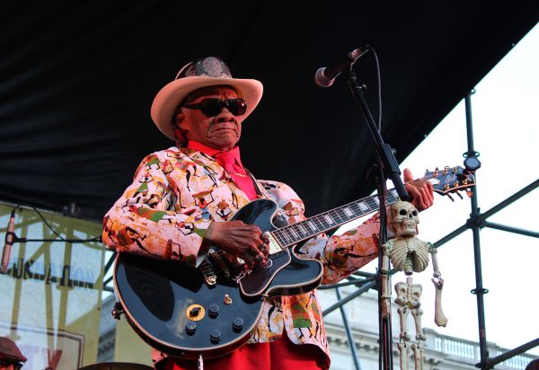 Little Freddie King performs live on stage drawing a large crowd. Little Freddie King is an American Delta blues guitarist.