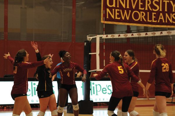 Volleyball team celebrates mid game on Sept. 29, 2023. The volleyball team has had a strong season.
