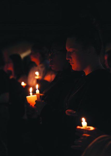 Students hold candles at annual Take Back the Night event on Oct. 17, 2023. This event is for community members from around New Orleans to stand in solidarity of violence against women. 