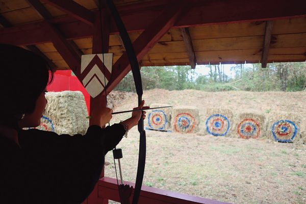 Jessie Jocom shoots arrows at the archery range. 
