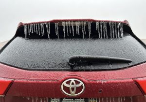 Ice coats vehicle in Bismarck, N.D., on Tuesday, Dec. 26, 2023.