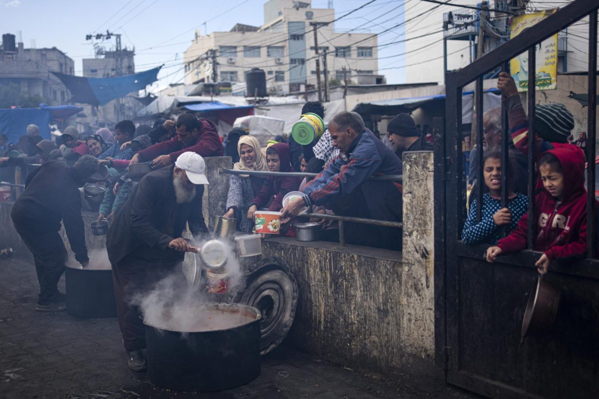 Palestinians line up for a free meal in Rafah, Gaza Strip, Friday, Feb. 16, 2024.
International aid agencies say Gaza is suffering from shortages of food and other basic supplies as a result of the war between Israel and Hamas. (AP Photo/Fatima Shbair)