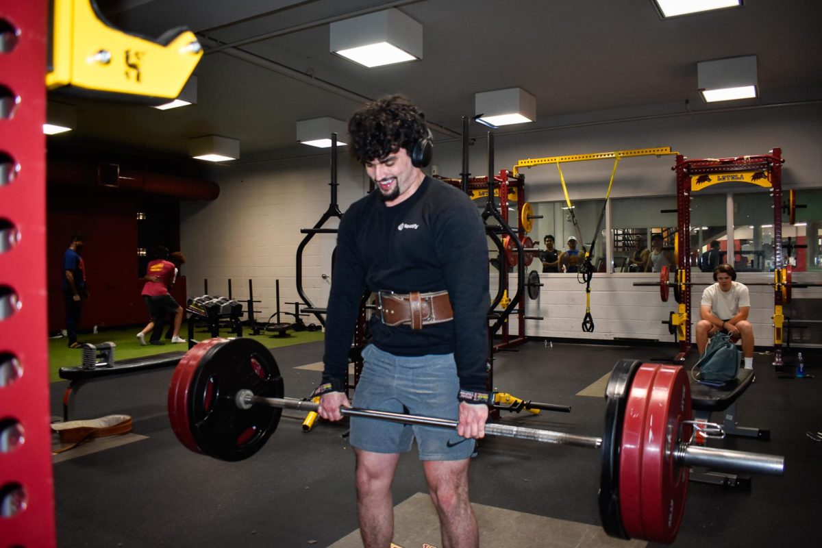 Ricardo Blondet-Otero, business management junior, deadlifts in the sports complex weight room on March 6, 2024.