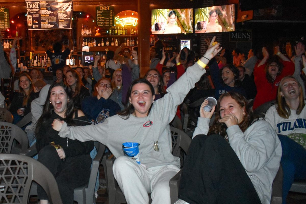 A crowd of Tulane and Loyola students at The Boot react with enthusiasm to Kelsey receiving the last rose and becoming a Bachelor finalist.