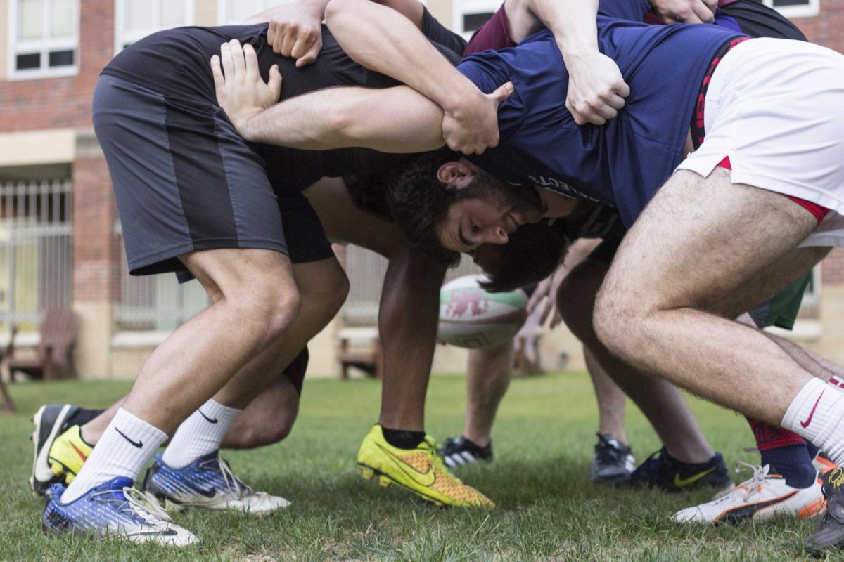 The Loyola rugby team practices a scrum during a team drill in April 2016. The Loyola Rugby team no longer exists.