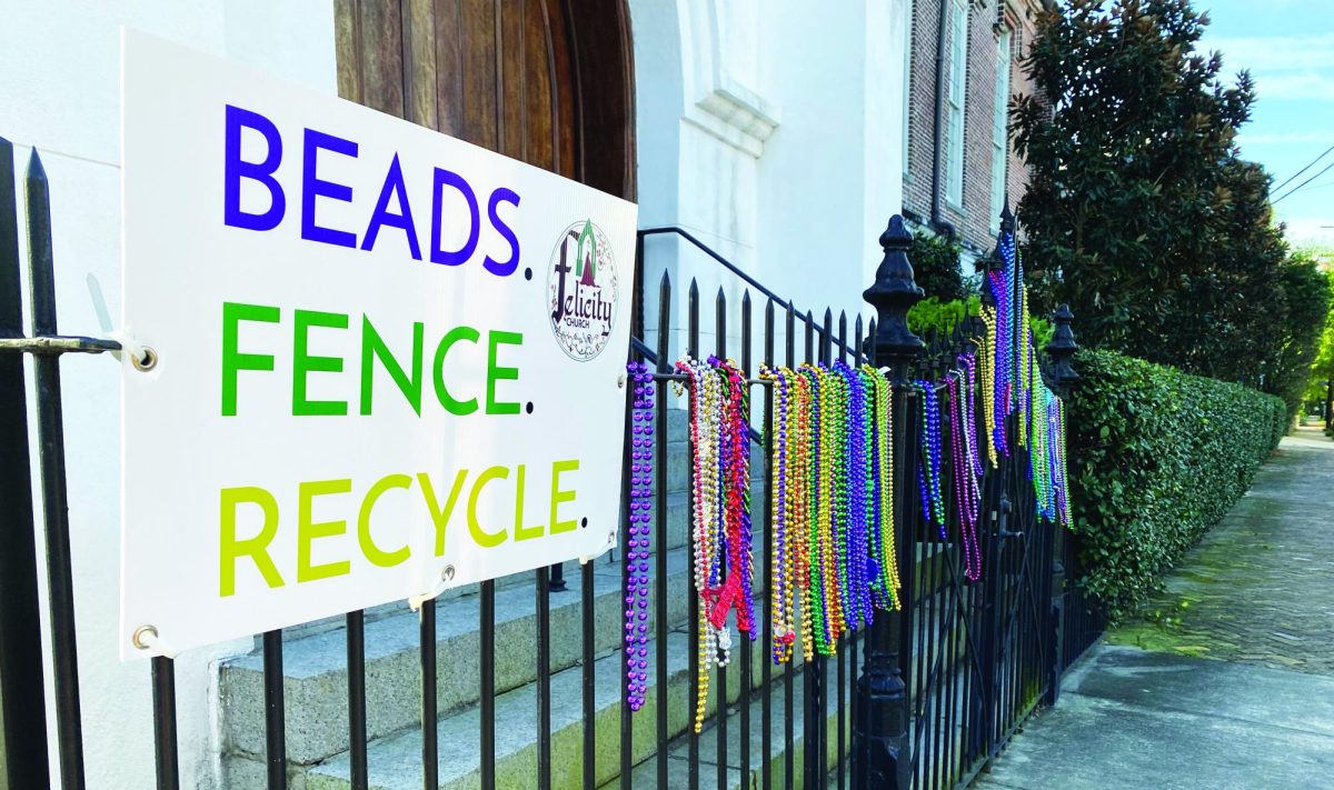 Sign reads Beads. Fence. Recycle. outside Felicity Street on Feb. 17, 2023. The church collects beads on their fence to recycle after Ash Wednesday.