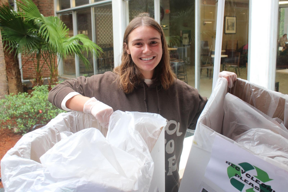 Jackie Mutter carries recycling bins in the Danna Center courtyard.
Courtesy of Jackie Mutter