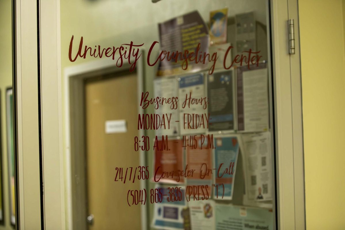 The University Counseling Center door displays their hours. 