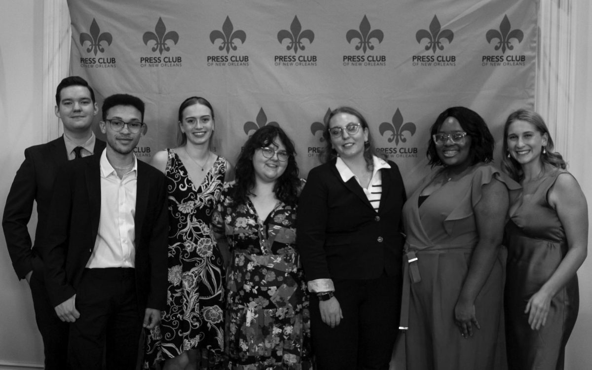 Current and past Maroon staff stand together at the Press Club award ceremony. 