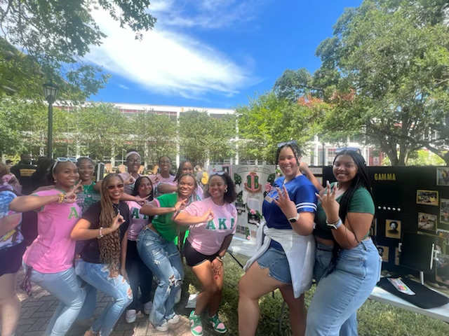 Members of Alpha Kappa Alpha Sorority, Inc. (Eta Theta Chapter) and Sigma Gamma Rho, Sorority, Inc. (Epsilon Sigma Chapter)  pose at "Letters in the Quad" Greek life event in the Peace Quad on Aug. 26. Over a dozen chapters attended the event organized by CPC President Asia Riddle.