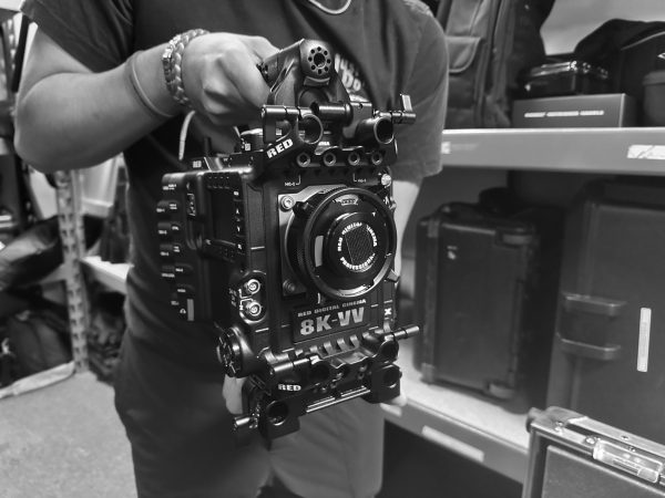 Steven Nguyen, film student, shows new camera equipment acquired by the grant.