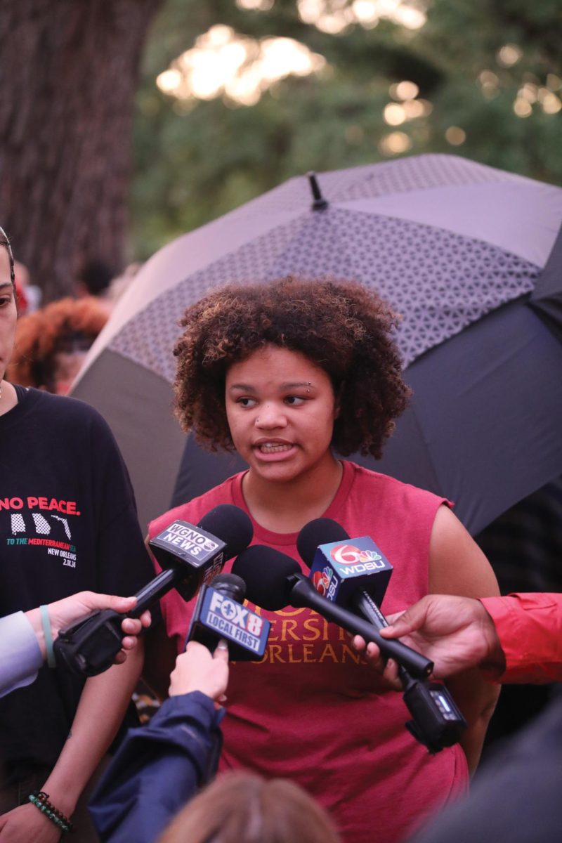 Juleea Berthelot speaks to reporters at the Tulane encampment in April.