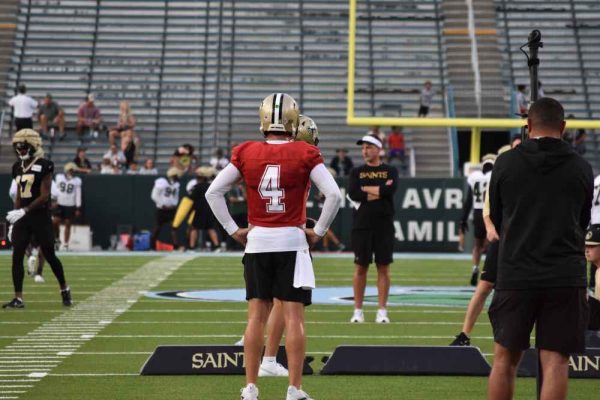 New Orleans Saints Quarterback Derek Carr stands in the field of Tulane's Yulman Stadium during an Open Practice on Tuesday, August 20.