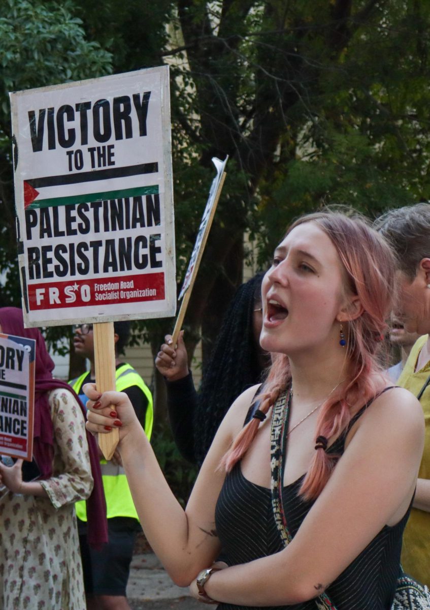 Protester chants outside of Loyola president Xavier Cole's home on Sep. 18, 2024. This rally and march was to continue to call for university disclosure of funds.