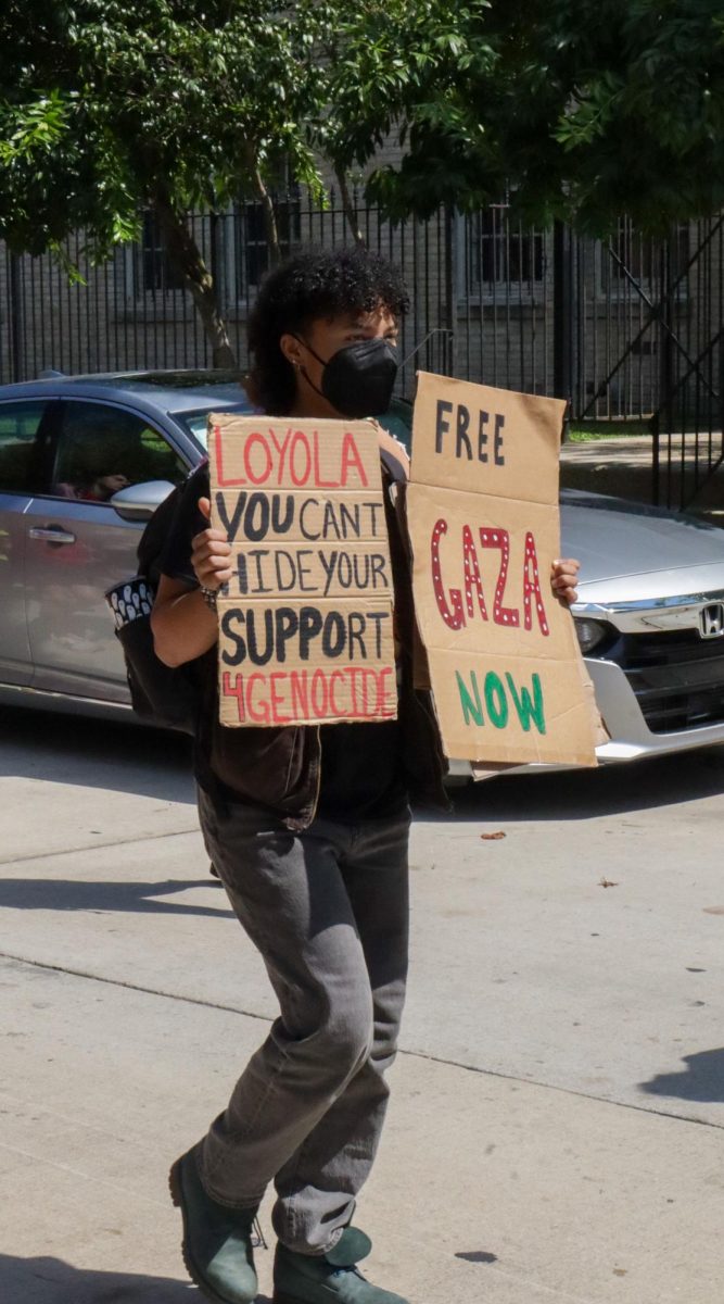 A pro-Palestinian protester marches down Calhoun on Oct. 7, 2024. This rally was held on the one year anniversary of the Israel-Hamas war resurgence.