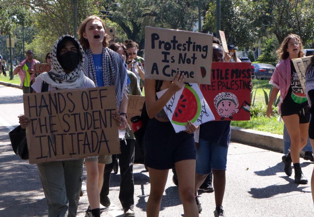 Pro-Palestinian protesters march down St. Charles Avenue on Oct. 7, 2024. This rally was held on the one year anniversary of the Israel-Hamas war resurgence.