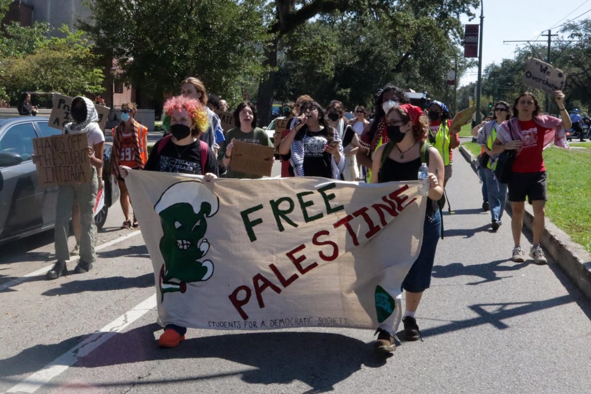 Pro-Palestinian protesters march down St. Charles Avenue on Oct. 7, 2024. This rally was held on the one year anniversary of the Israel-Hamas war resurgence.