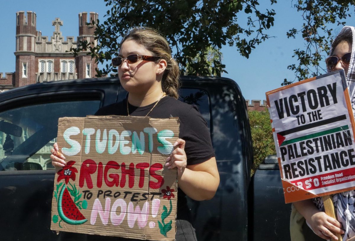 Pro-Palestinian protesters stand outside Loyola University on Oct. 7, 2024. This rally was held on the one year anniversary of the Israel-Hamas war resurgence.