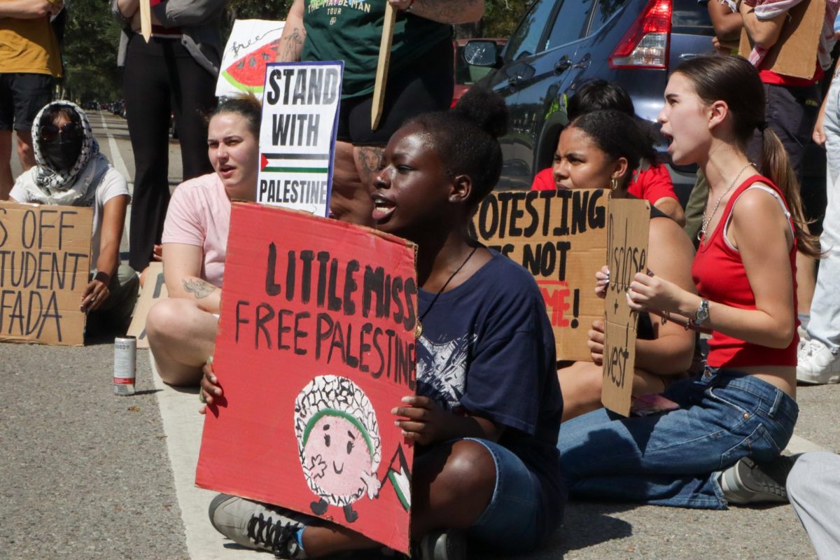 Pro-Palestinian protesters sit outside Loyola University on Oct. 7, 2024. This rally was held on the one year anniversary of the Israel-Hamas war resurgence.