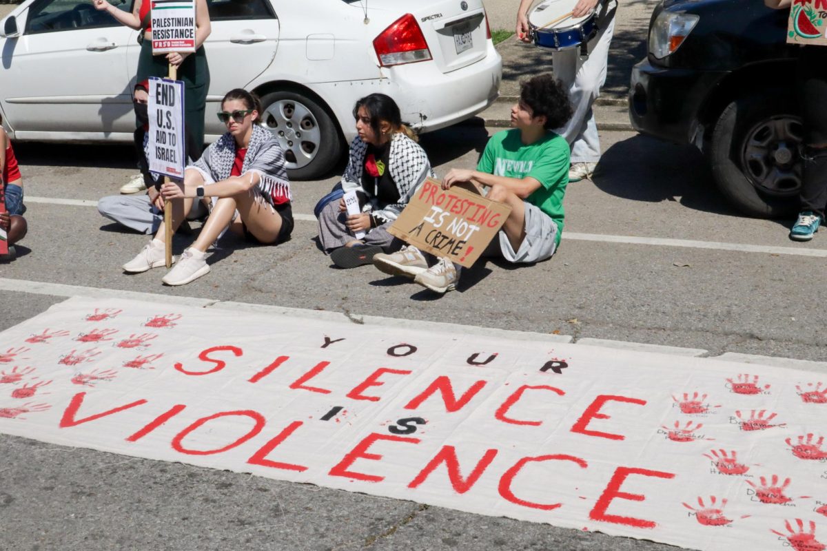Pro-Palestinian protesters gather on St. Charles Avenue outside Loyola University on Oct. 7, 2024. This rally was held on the one year anniversary of the Israel-Hamas war resurgence.