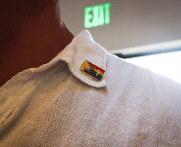 Ken Weber wears pride pin with a cross.