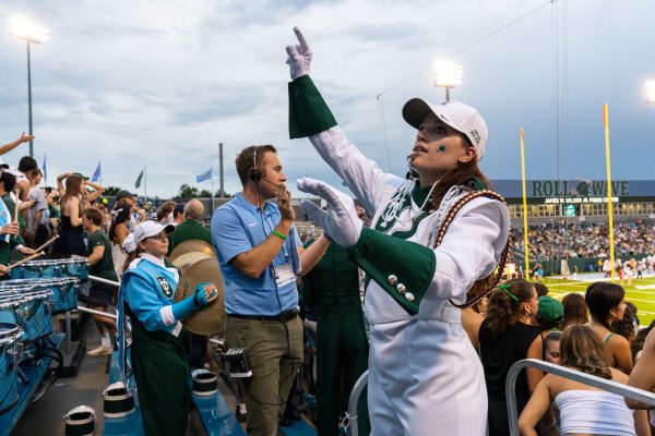 Jazz studies senior Willa Rudnick conducts the Tulane University Marching Band at a Tulane football game. Courtesy of Willa Rudnick.