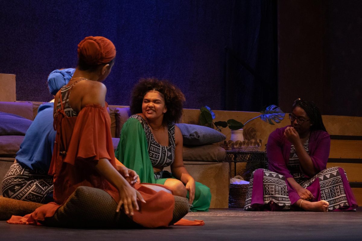 From left: Enne Samuel, Nala Aolani Scaife, Amani Weary, Ime James performing in Loyola's production of 'for colored girls who have considered suicide / when the rainbow is enuf'.