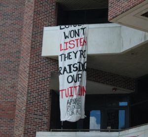 Loyola students drop a banner the Communications/Music Complex criticizing tuition raises on April 29, 2025. Loyola University New Orleans plans to raise tuition prices for all students. 