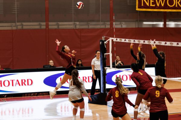 Samantha Guillotte spiking a volleyball at a game. Abby Smith/ Loyola Univeristy New Orleans Atheltics