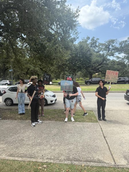 Loyola students gather on St. Charles to protest ICE, tuition raises, and to advocate for the protection of diversity programs on Aug. 28, 2025.