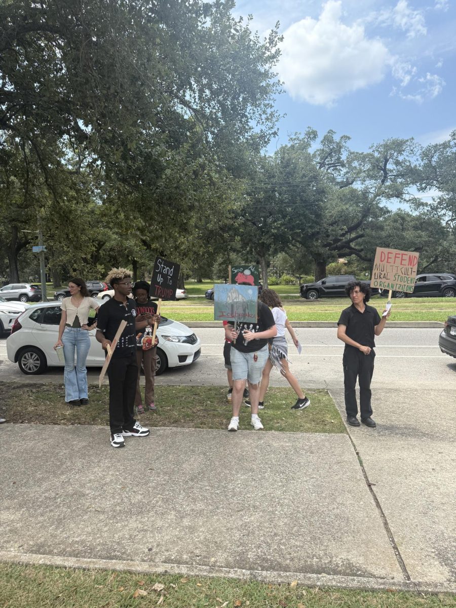 Loyola students gather on St. Charles to protest ICE, tuition raises, and to advocate for the protection of diversity programs on Aug. 28, 2025.