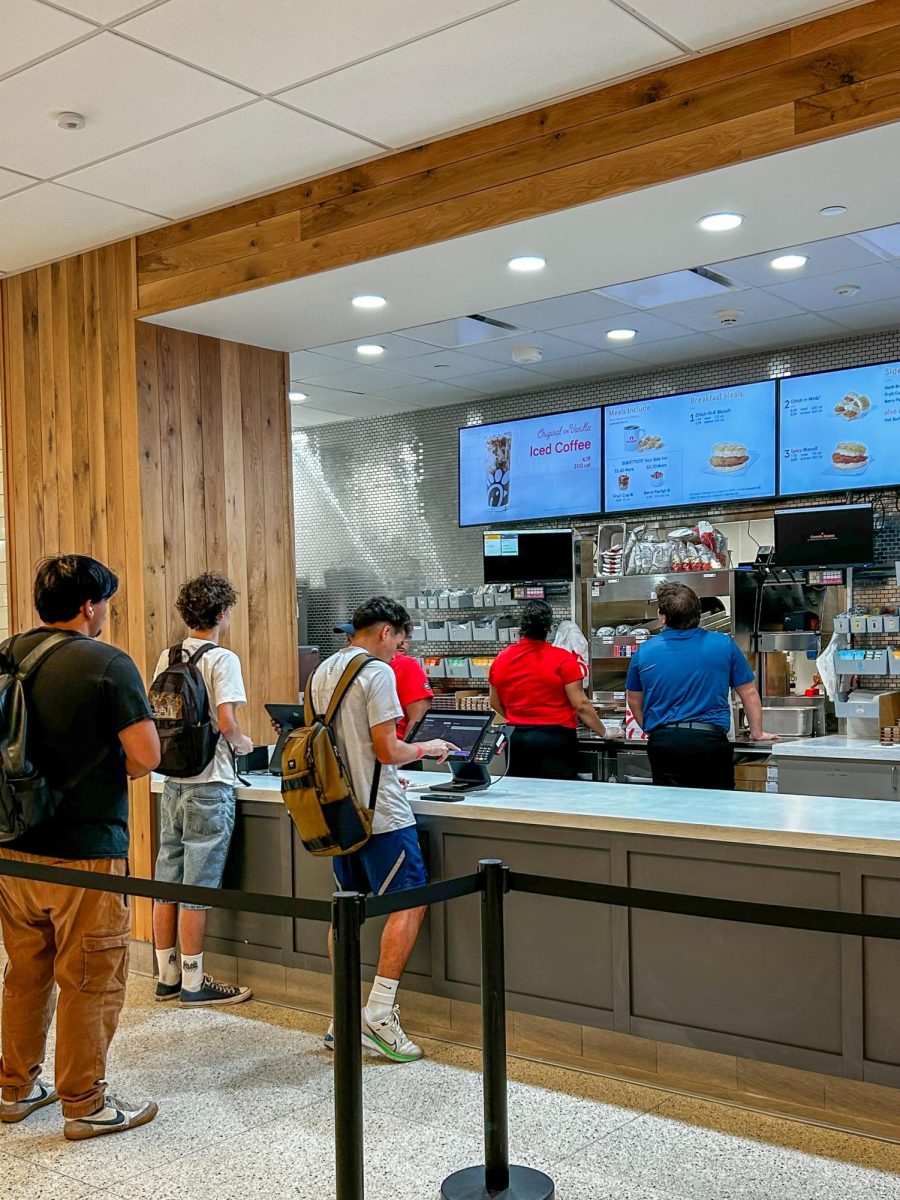 Three students line up at Loyola's Chick-fil-A to place their orders on the morning of Aug. 25. Chick-fil-A has opened today following months of construction. 