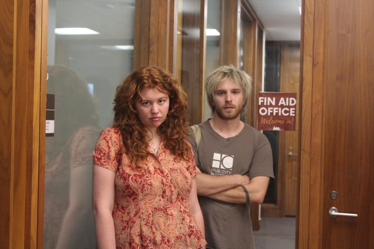 Jude Landsberger and Aiden Pilley infront of Financial Aid. 