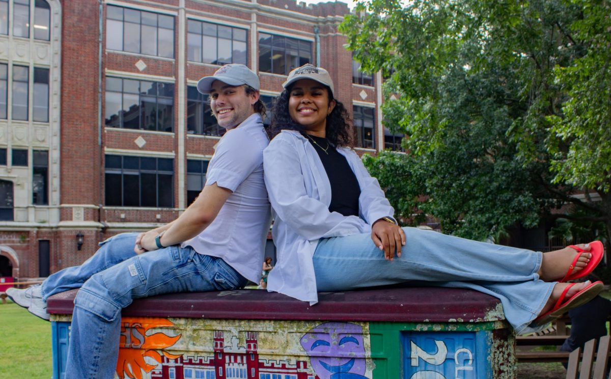 SGA President Nicholas Keen and Vice President Jessica Valerio pose on street car statue located in the Peace Quad. Keen and
Valerio were elected for the 2025-2026 school year.