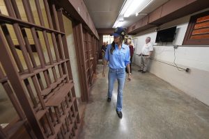 Homeland Security Secretary Kristi Noem, center, tours "Camp 57," a facility to house immigration detainees at the Louisiana State Penitentiary in Angola, La., Wednesday, Sept. 3, 2025. 
