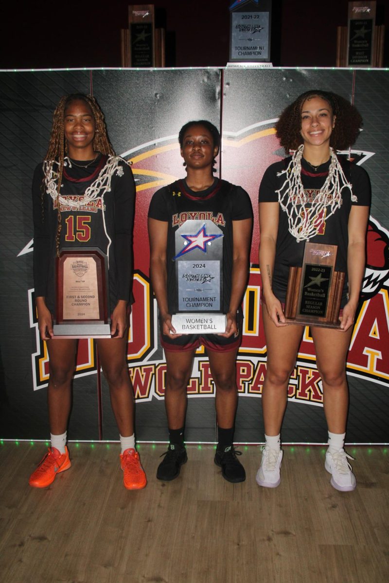 Deniya Thornton, Caitlin Travis, and Alissa Odell posed with trophies in Hall of Fame. 