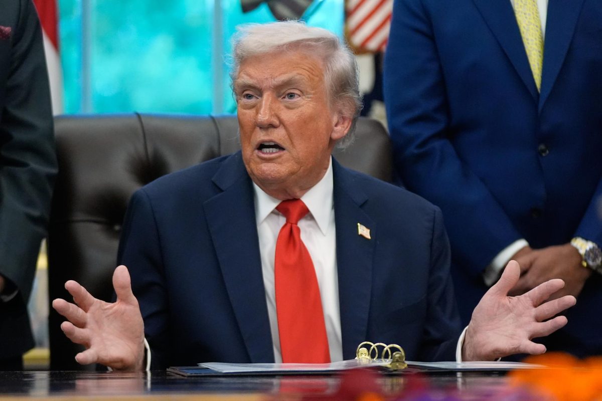 President Donald Trump answers questions from reporters during a Diwali celebration in the Oval Office at the White House, Tuesday, Oct. 21, 2025, in Washington.