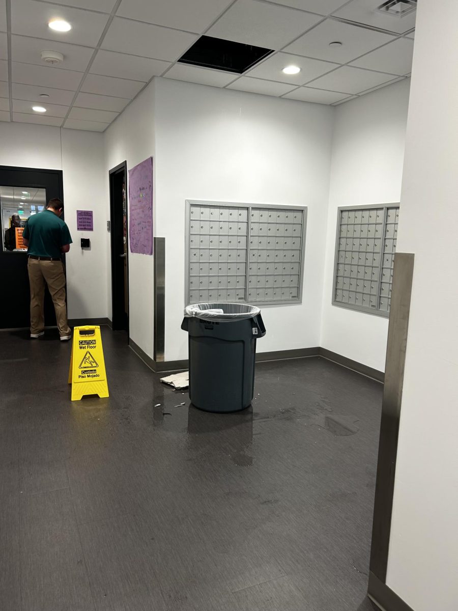 Photo of ceiling tile on the floor and leakage in Uptown Residence Hall on Oct. 24, 2025.