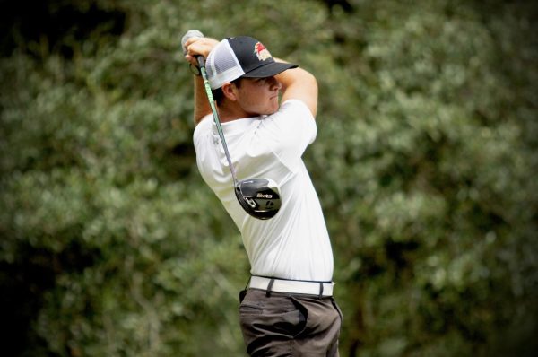 Cole Hasse competes in a golf tournament, showcasing his focus and precision on the course. Courtesy Cole Hasse