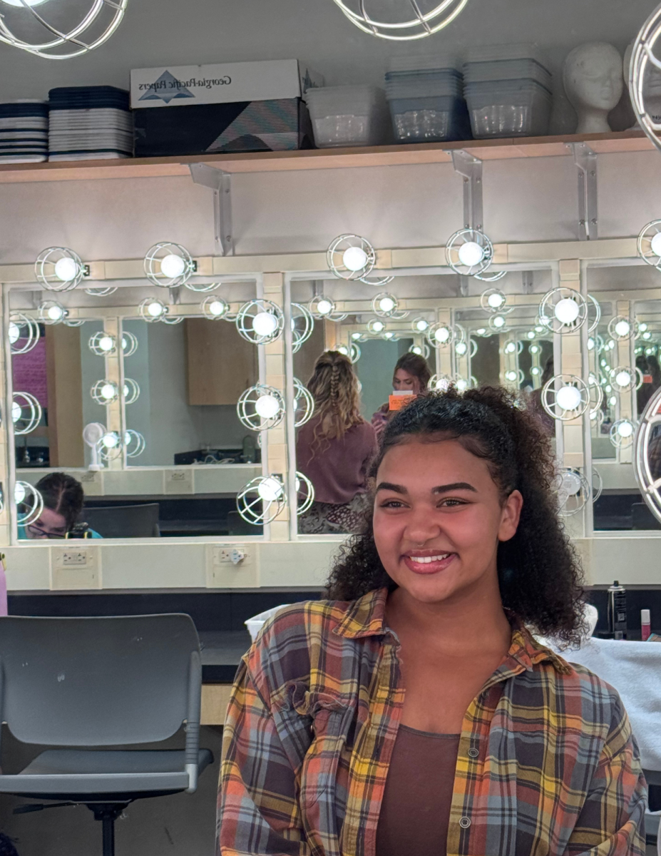 Weary smiles in the mirror as she prepares for the opening night of Ghost Quartet on October 17, 2025.
