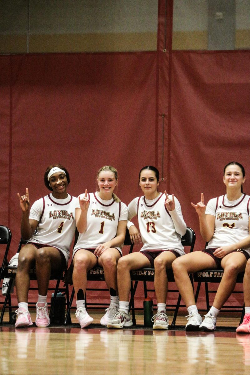 Jada Washignton , Addison Luker, Isabella April, and Taylor Smith holding up the wolf pack hand sign during home game on the sidelines. They have recently won thier first two home game.  Courtesy of Heidi Herrera-Wanke