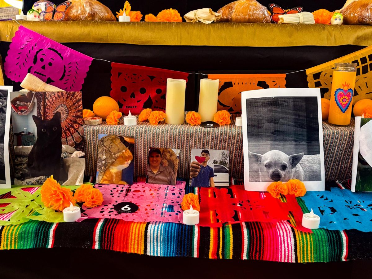 Loyola's campus ofrenda features various students' deceased loved ones, honoring them for Dia de Los Muertos. 