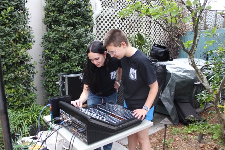 Johnson and Grady-Mullen working audio tech at an event at the Chloe hotel on March 23rd, 2025.  Photo courtesy of  Ana Guilbeau