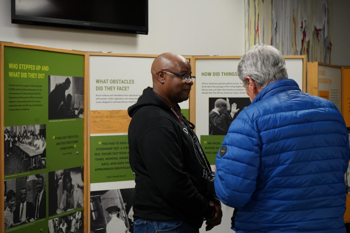A local New Orleans photographer talking to a member of the uptown community.