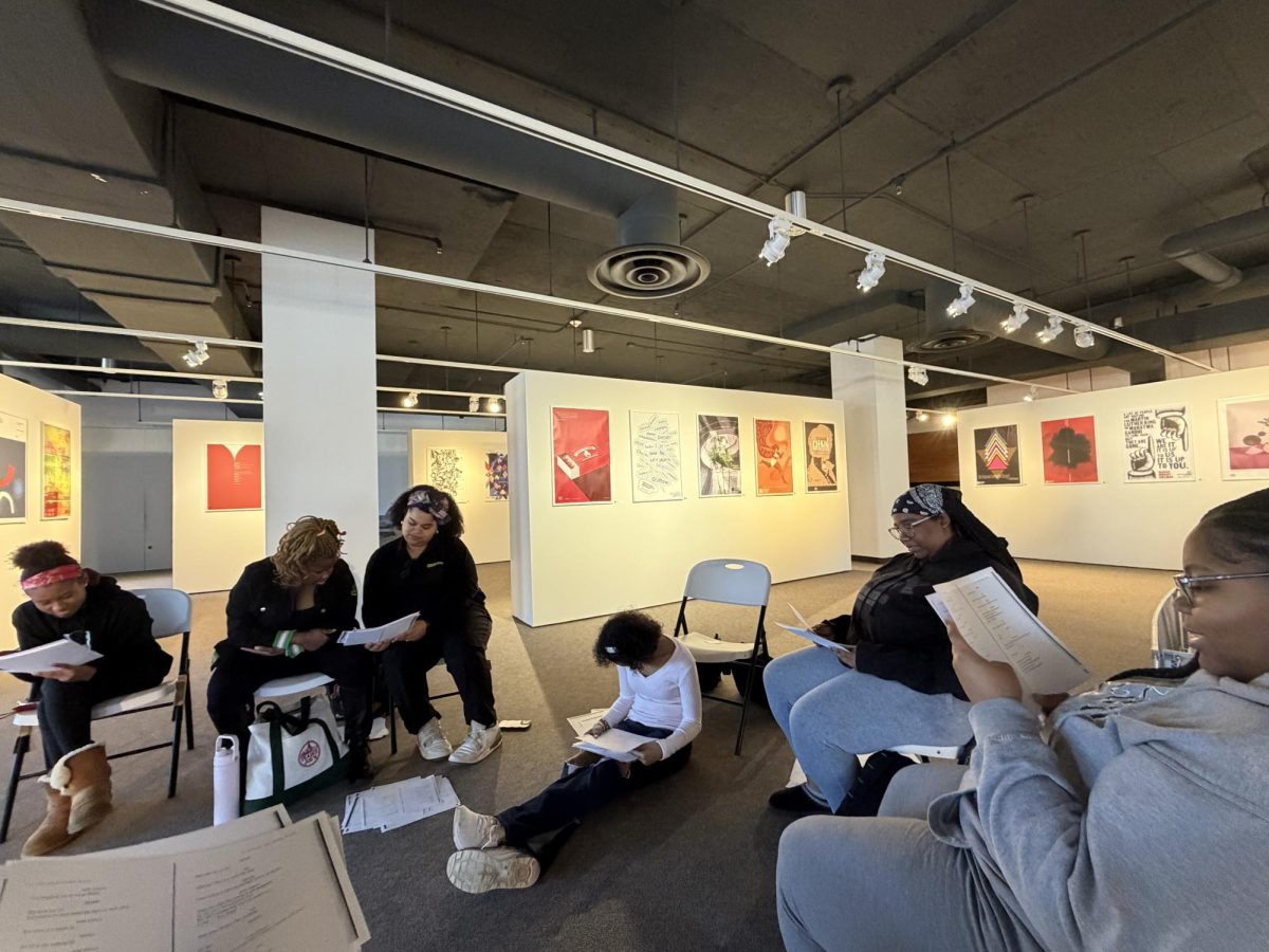 Theater for the Culture students cold read scenes from Choir Boy by Tarrell Alvin McCraney on the fourth floor of Monroe Library. 
